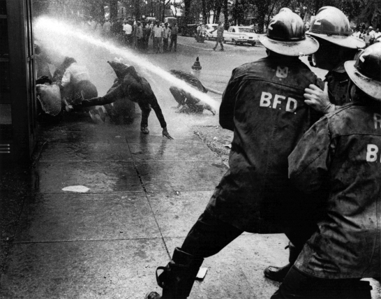 FILE - In this July 15, 1963 file photo, firefighters aim their hoses on civil rights demonstrators in Birmingham, Ala. 1963 was a year of revolution in race relations in the United States. (AP Photo/Bill Hudson, File)